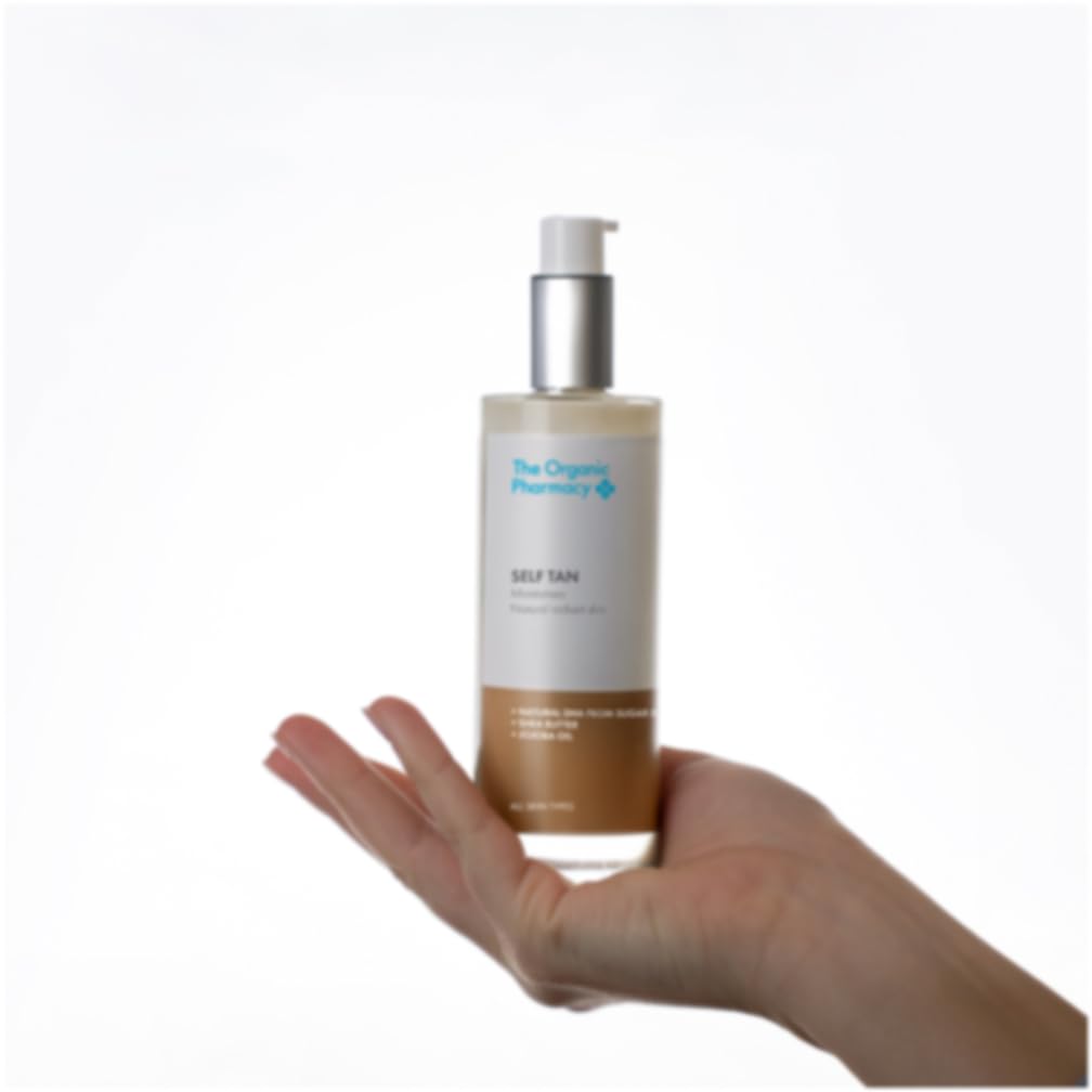 The Organic Pharmacy Self Tan Lotion being applied to the face with circular motions for a natural glow.