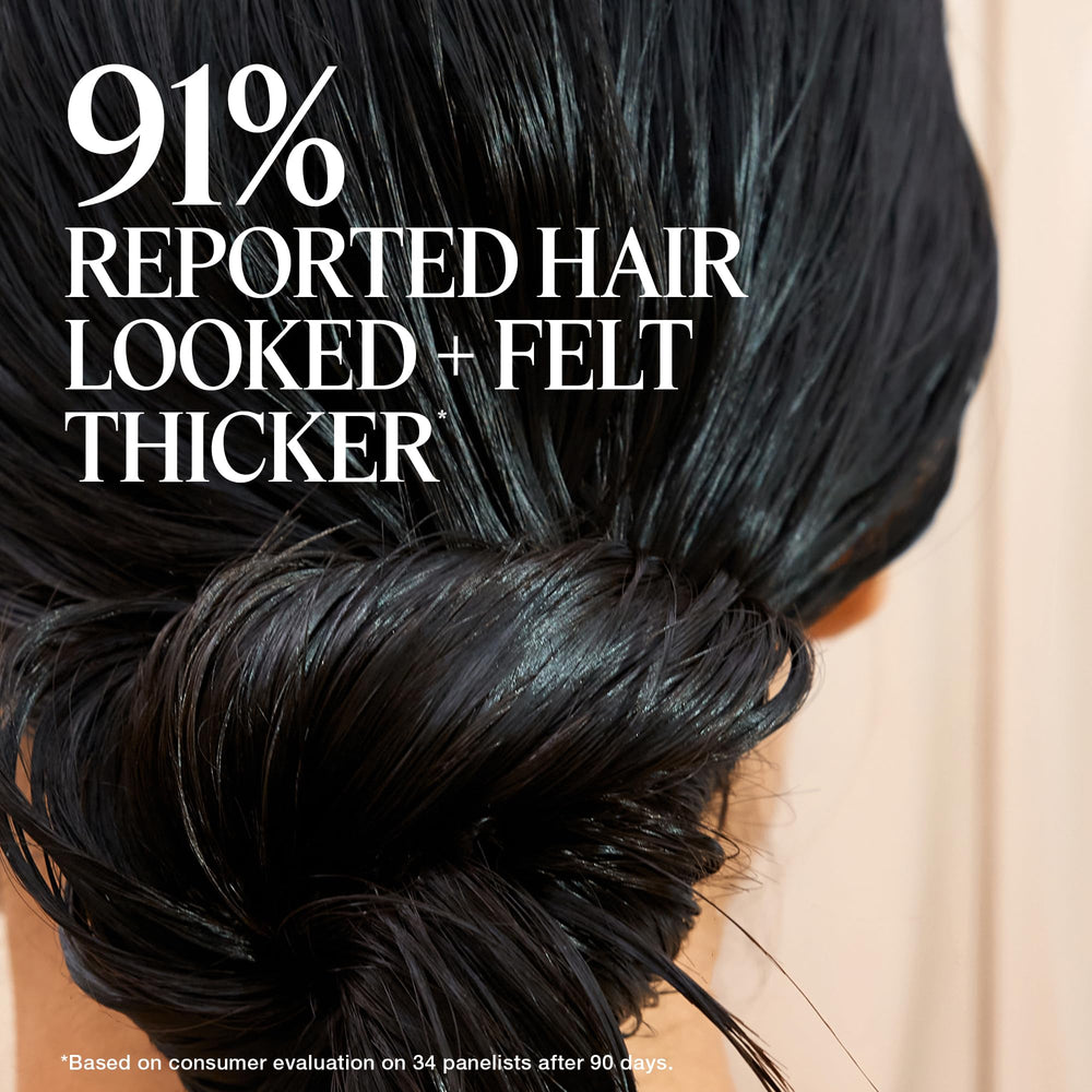 The Rootist Densify application on hand demonstrates easy dosing for fine hair.