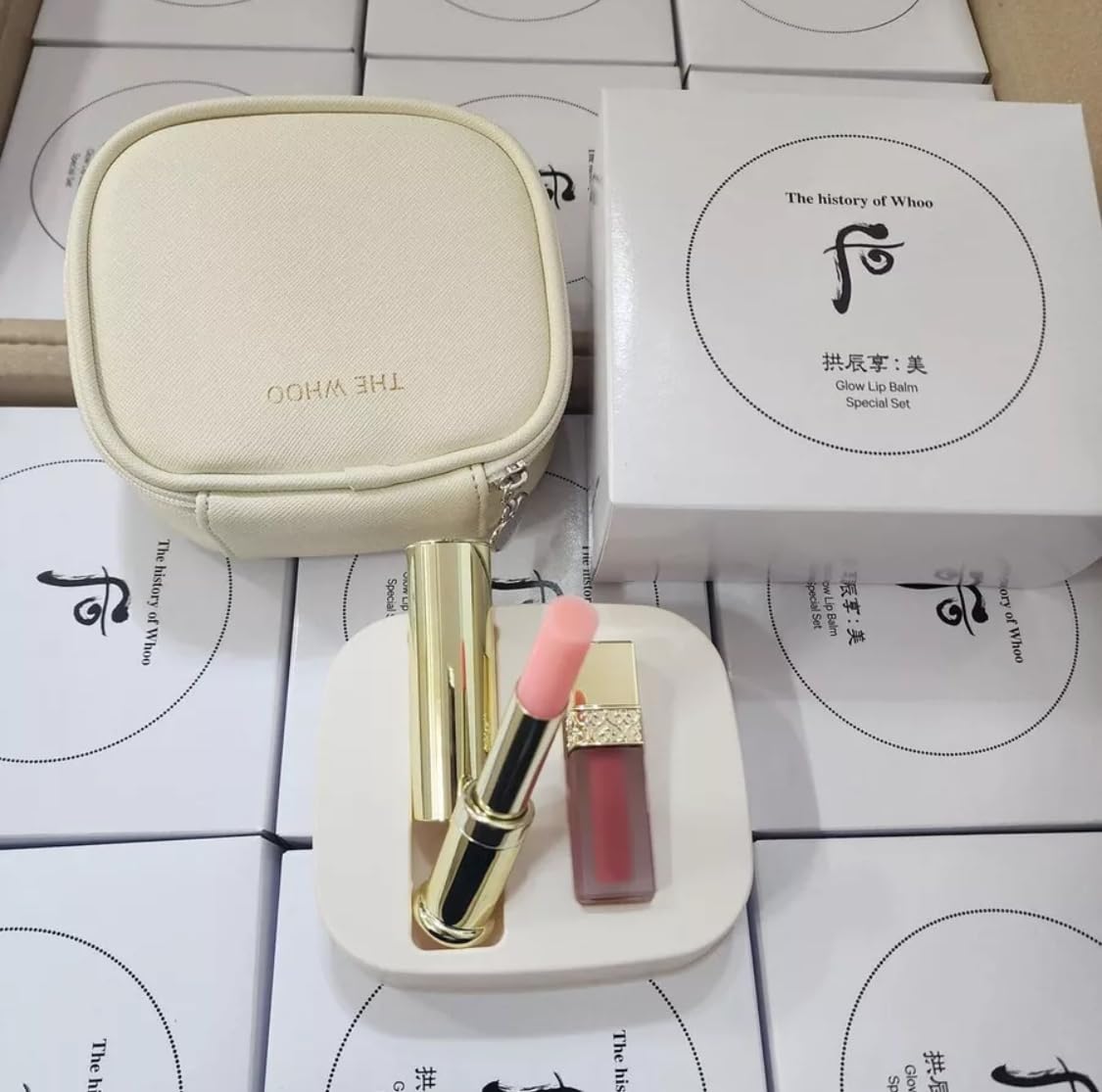 Lifestyle shot of THE WHOO Glow Lip Balm set in daily routine.