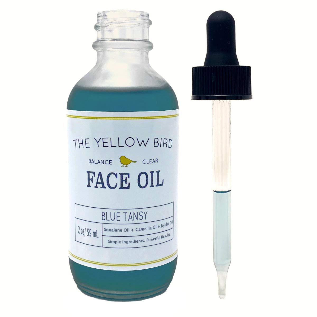 The Yellow Bird Balancing Blue Tansy Oil USA-made label signals premium vegan care.