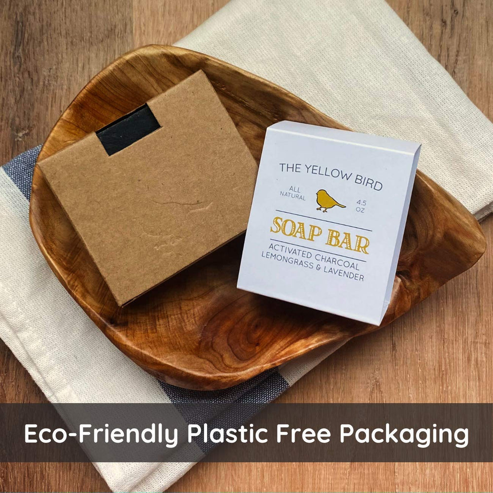 The Yellow Bird handmade charcoal soap with lemongrass-lavender scent offers a calming wash experience.