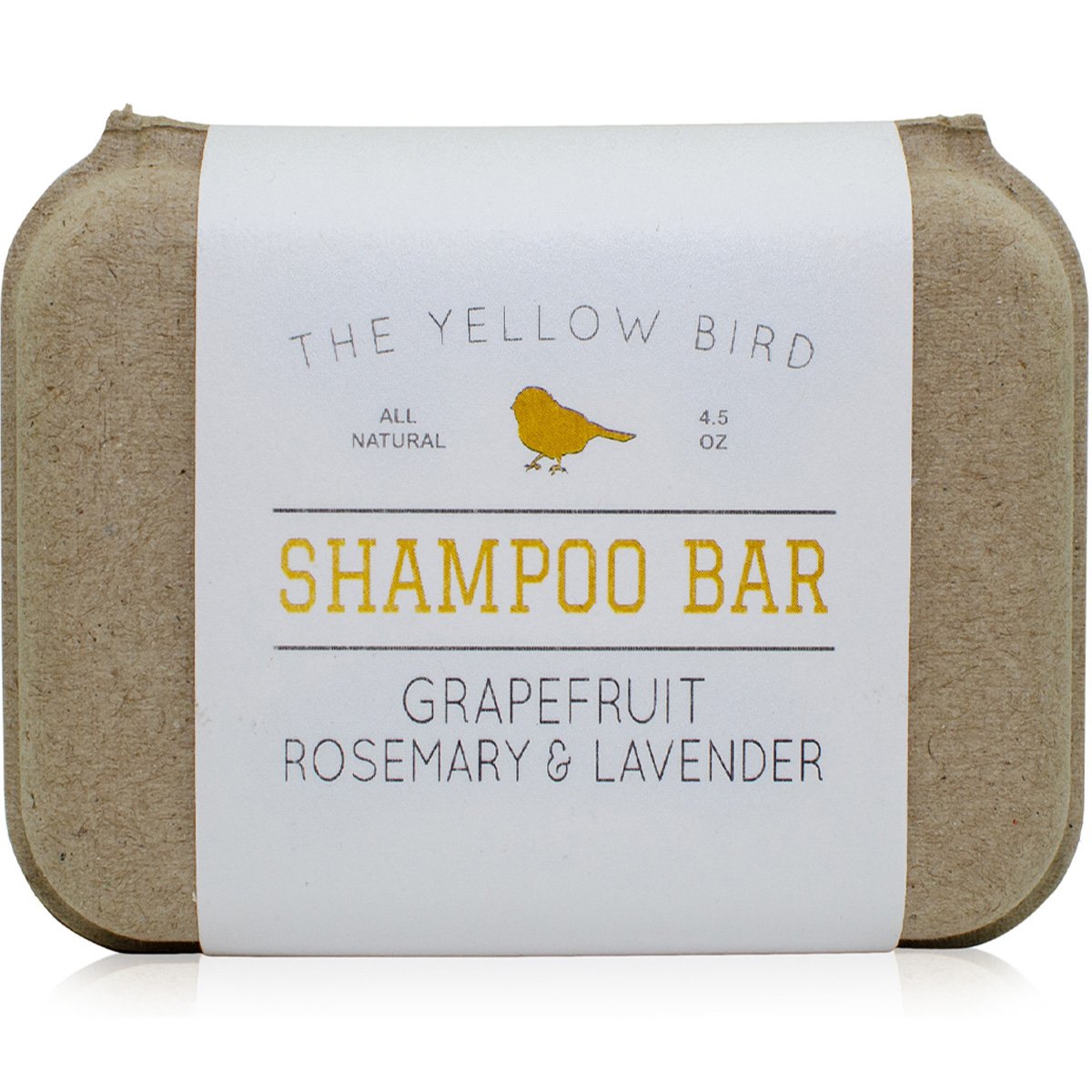 The Yellow Bird solid bar shampoo close-up showing grapefruit-rosemary-lavender aroma for gentle cleansing.