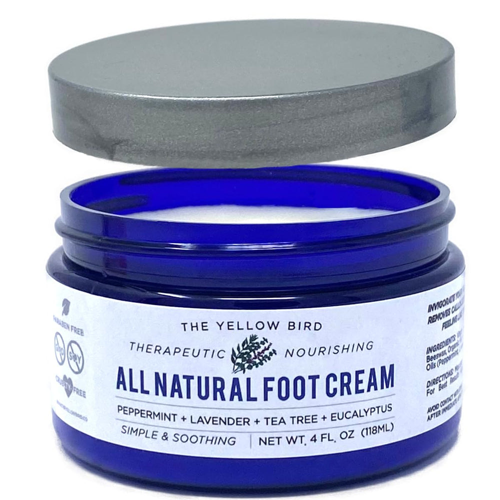 The Yellow Bird Tea Tree Foot Cream bottle provides deep hydration for dry feet.