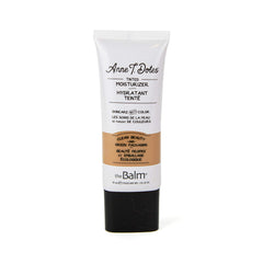 theBalm Anne T. Dotes tinted moisturizer shade 34 swatch on tan skin.