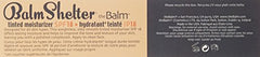 thebalm BalmShelter Dark tube close-up shows compact packaging ideal for on-the-go.
