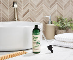 Thicker Fuller Hair Root Boosting Serum texture close-up reveals light, non-greasy feel