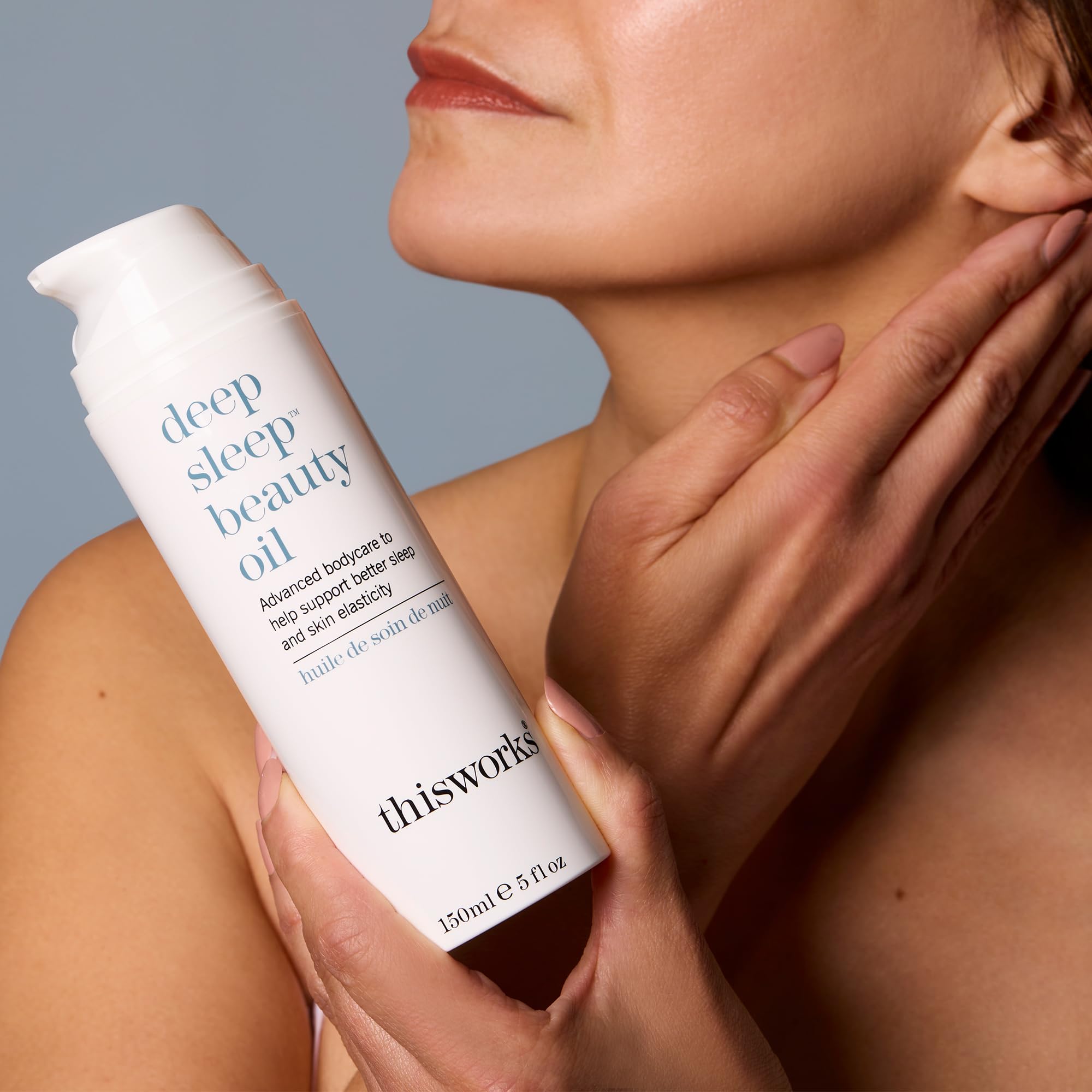 THISWORKS Deep Sleep Beauty Oil in hand highlighting botanical blend for nightly restoration.