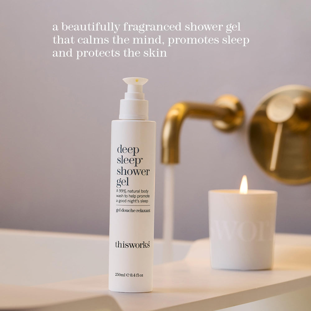 Pouring THISWORKS Deep Sleep Shower Gel into hand to reveal creamy lather
