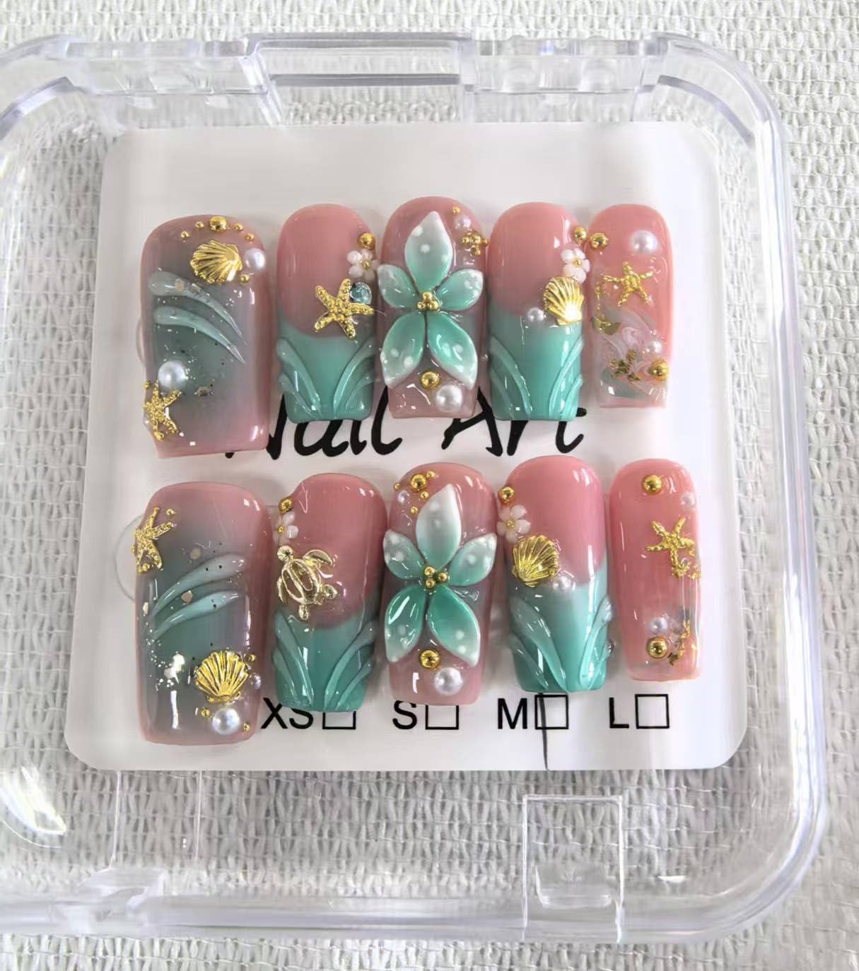 Threelegscat nails with sparkling rhinestones add luxe sparkle for celebrations.