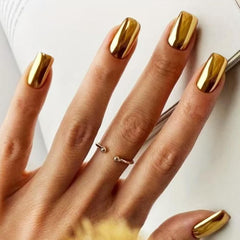 Thuoxde gold chrome press-on nails kit dazzles with mirror finish for elegant at-home manicures.