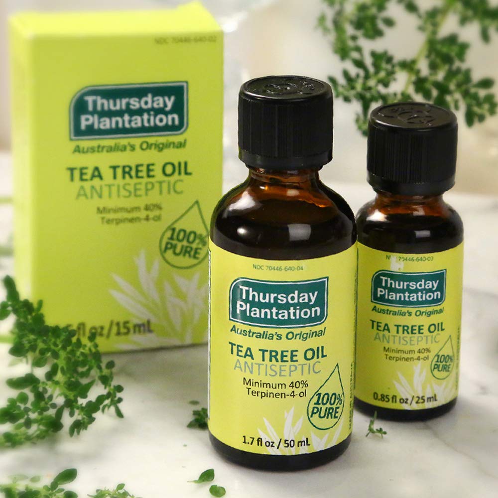 Thursday Plantation Tea Tree Oil label closeup with 100% natural content.