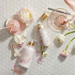 Creamy foam from Thymes body wash forming a rich shower lather
