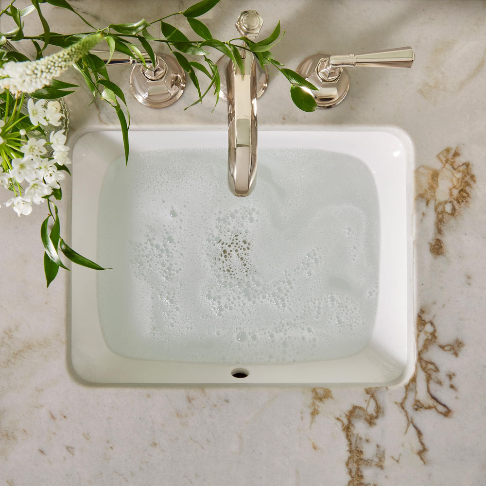 Thymes botanically-inspired packaging complements spa-like bathroom aesthetics.