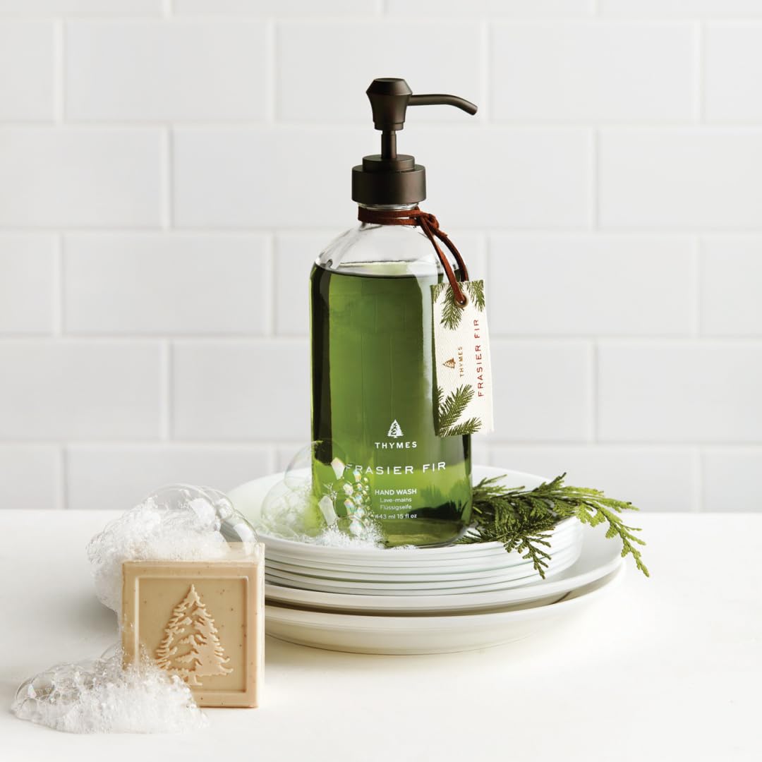 Thymes Frasier Fir bottle by sink creates inviting, woodsy ambiance