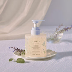 Pump-action bottle close-up delivering rich foam and lavender aroma.