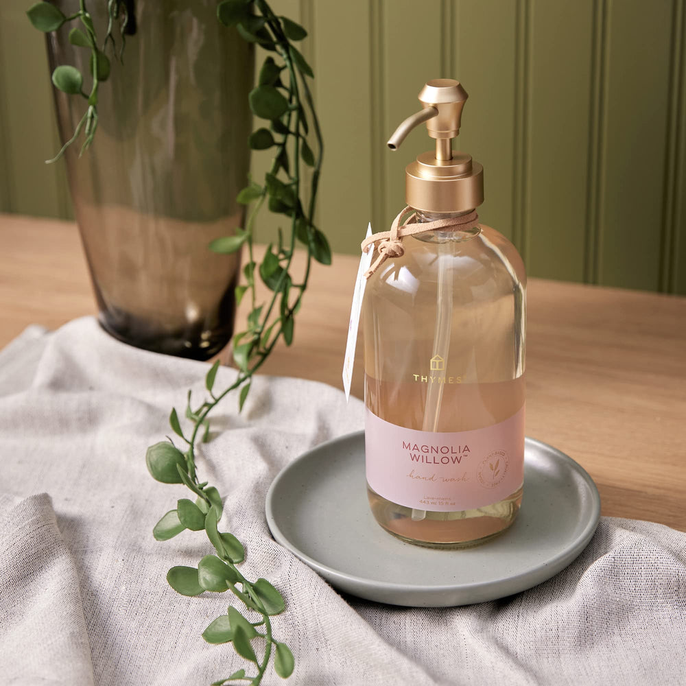 Thymes packaging design featuring eco-friendly bottle and label.