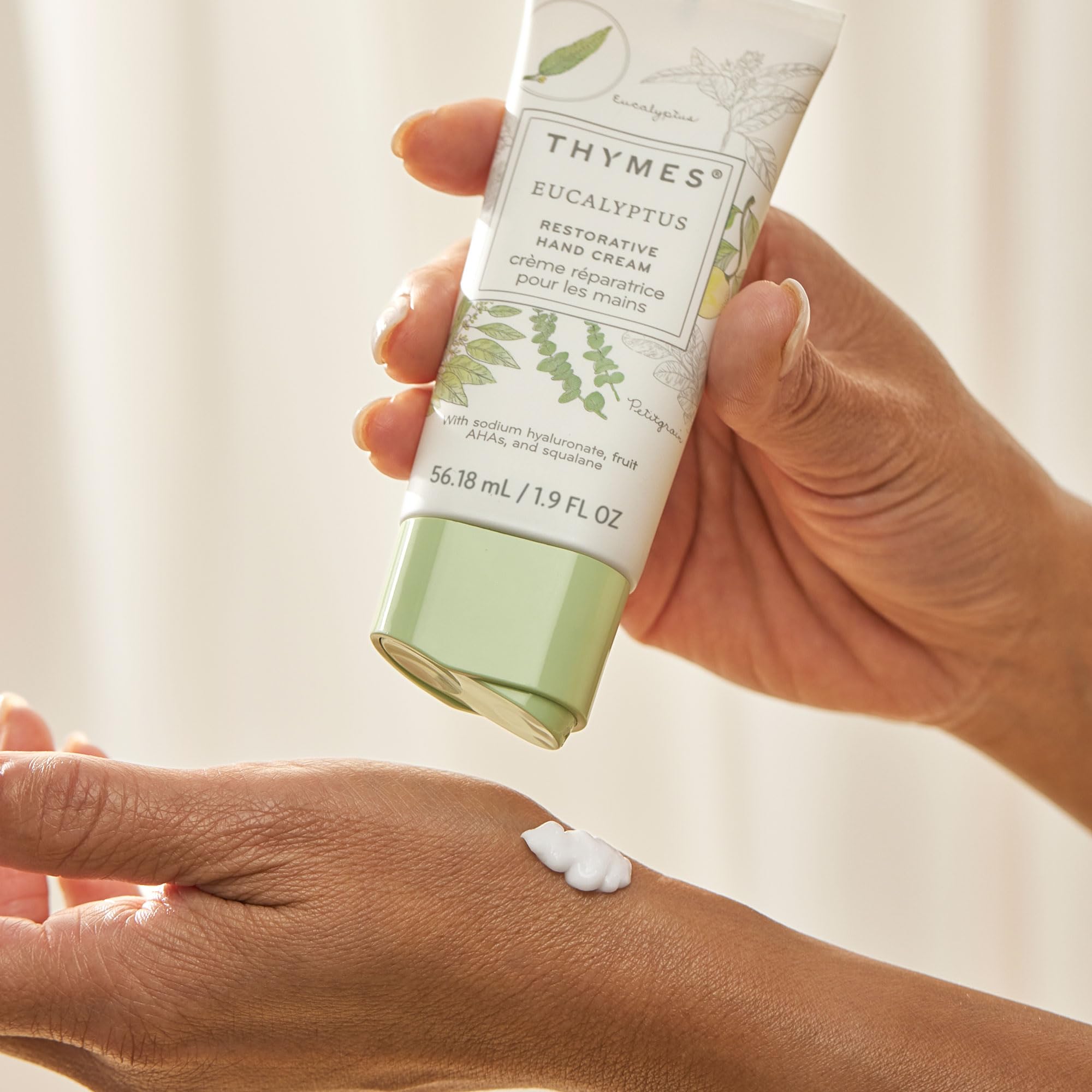 Thymes bottle label closeup communicates cruelty-free and paraben-free formulation.