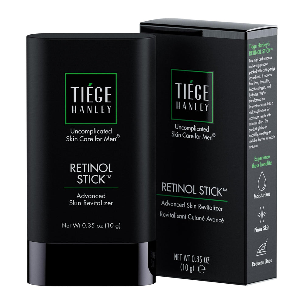 Tiege Hanley Retinol Stick on forehead for smoother texture and hydration.