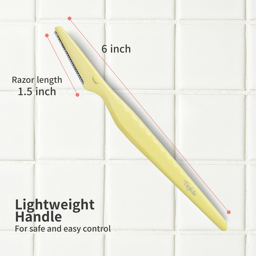 Tinkle Everglow Dermaplane Razor on a vanity for quick touchups.
