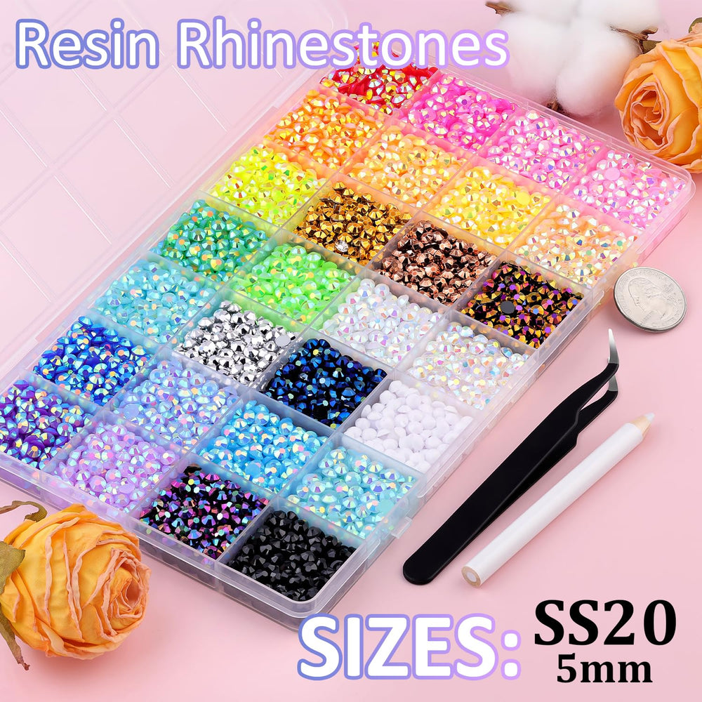 TINKRSTUFF tweezers and pickup pen for precise rhinestone placement.