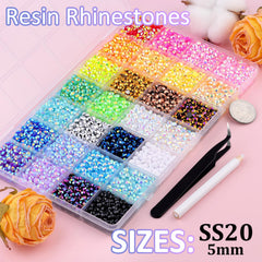 TINKRSTUFF tweezers and pickup pen for precise rhinestone placement.