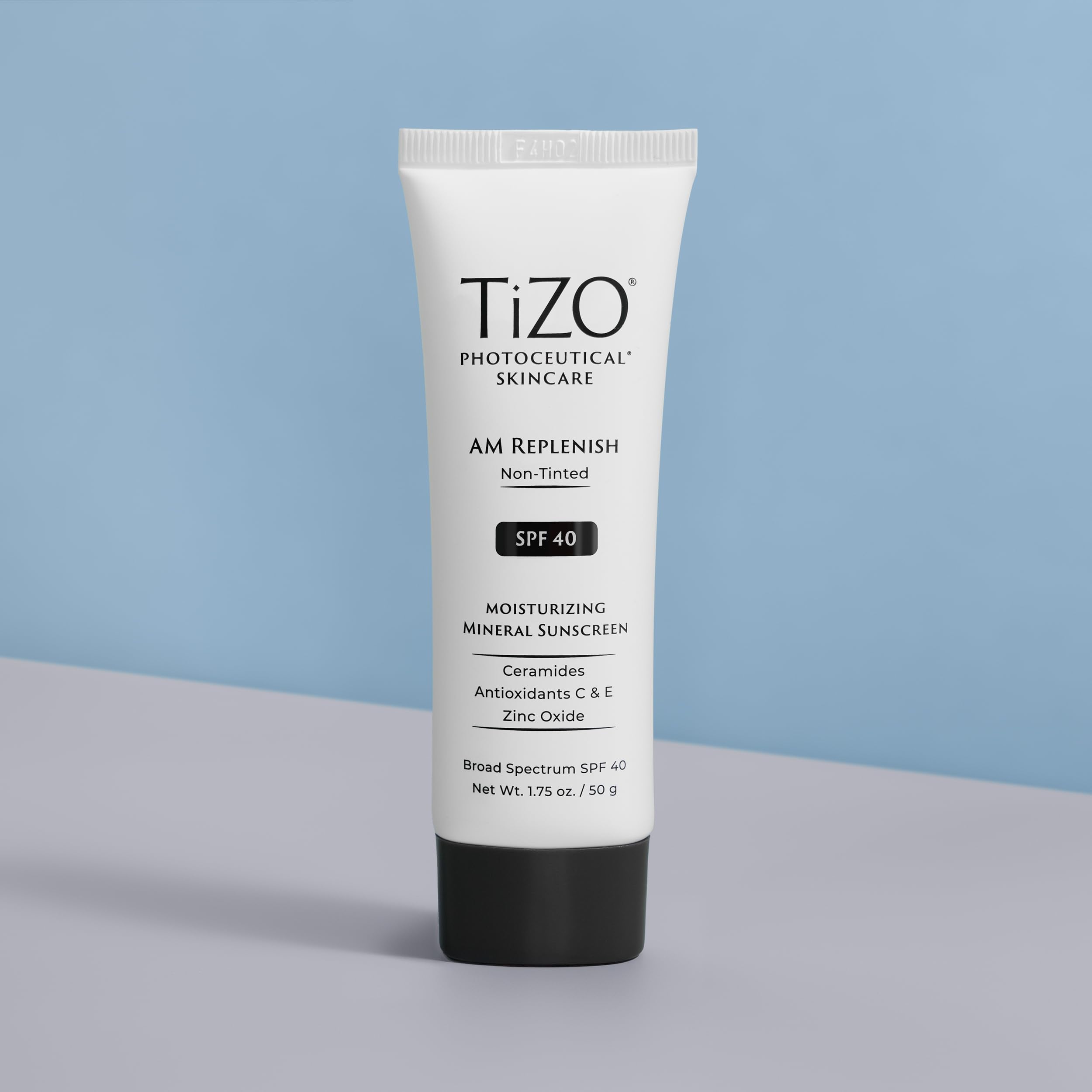 TIZO AM Replenish packaging close-up highlights compact, preservative-free formula