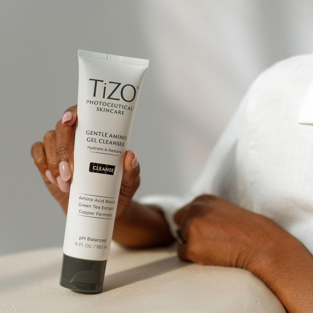 TiZO bottle highlights green tea extract and amino acids for balance and nourishment.
