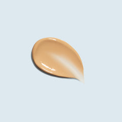 TiZO Mineral Sun Defense application swatch shows sheer tint and satin finish.