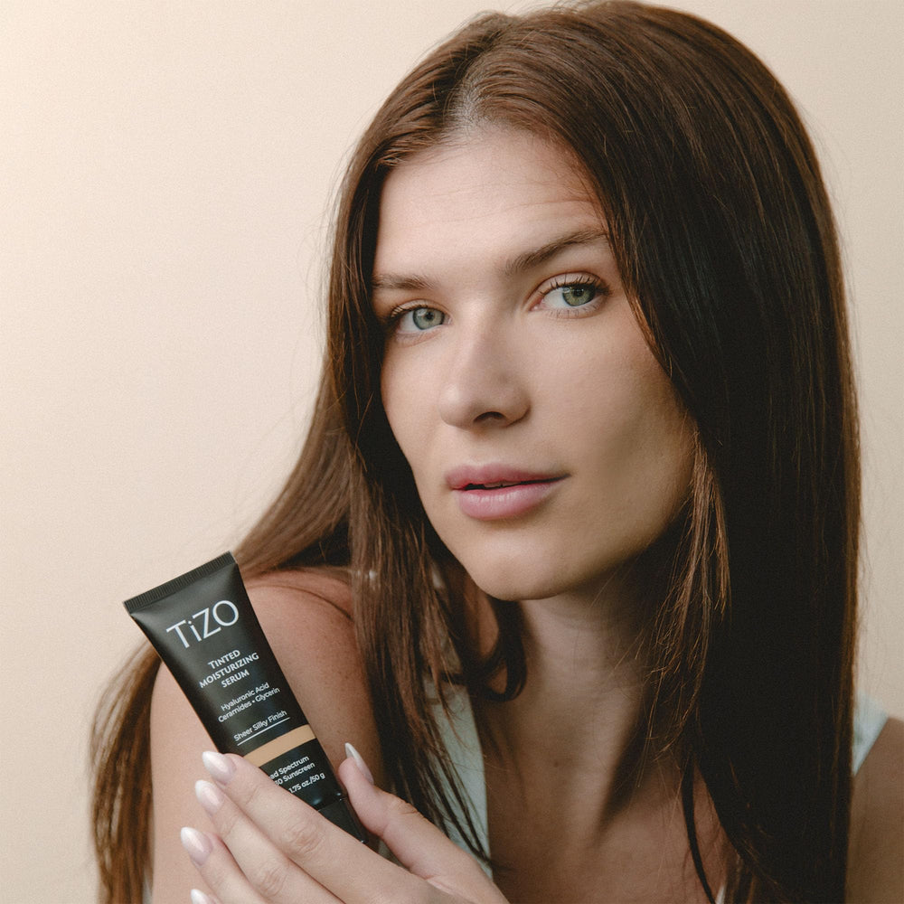 TIZO tinted formula swirl demonstrates sheer blend into skin