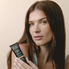 TIZO tinted formula swirl demonstrates sheer blend into skin