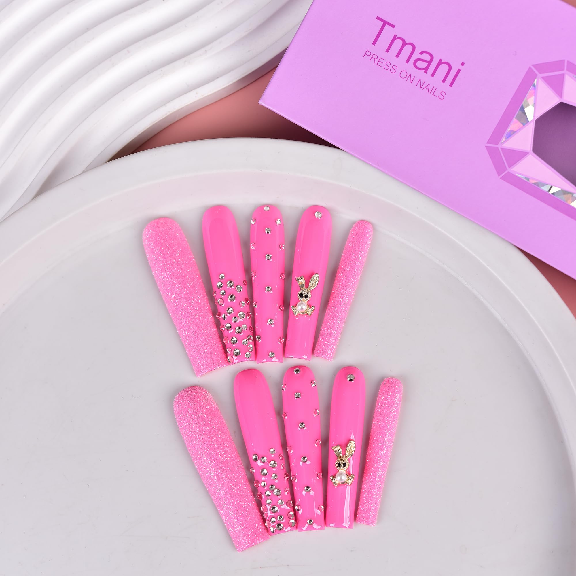 Tmani 10-piece set includes file and glue for easy at-home manicure.