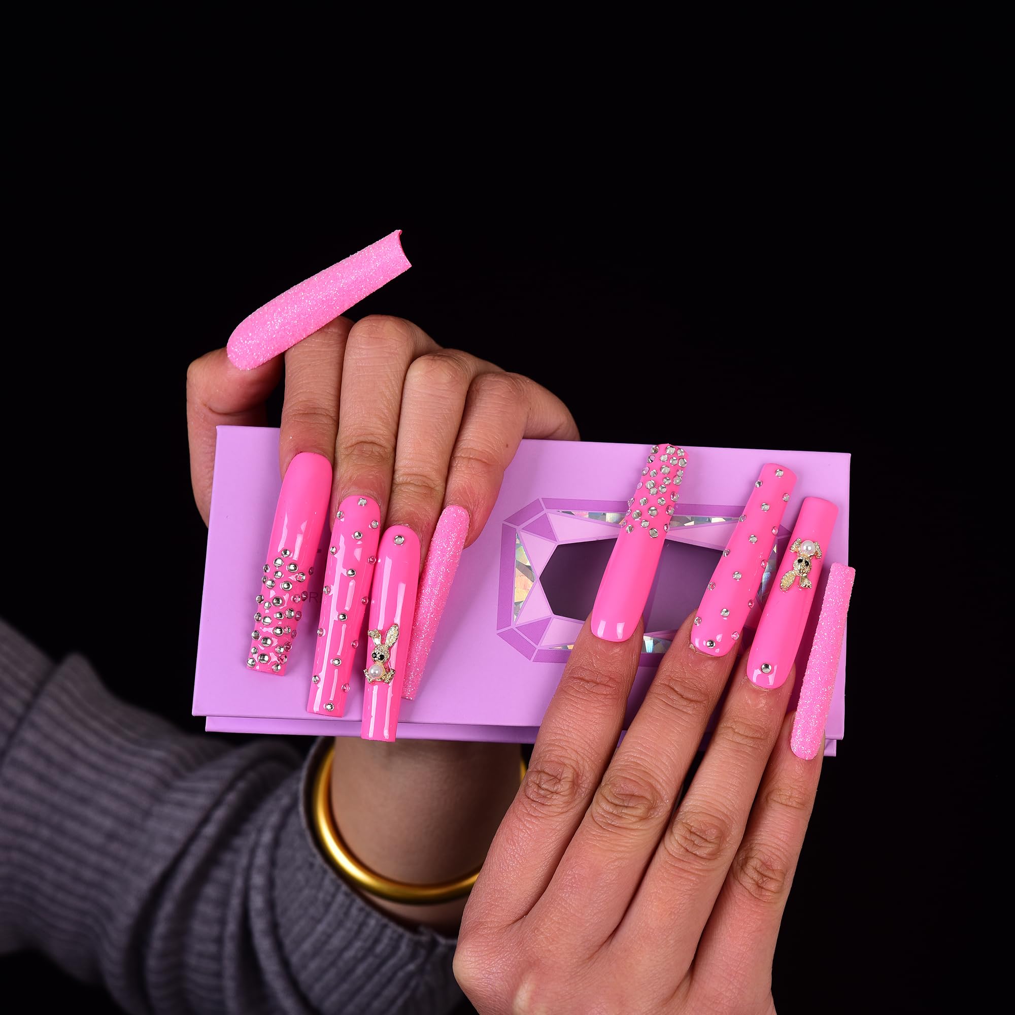 Tmani diamond glitter decor nails catch light for sparkle.