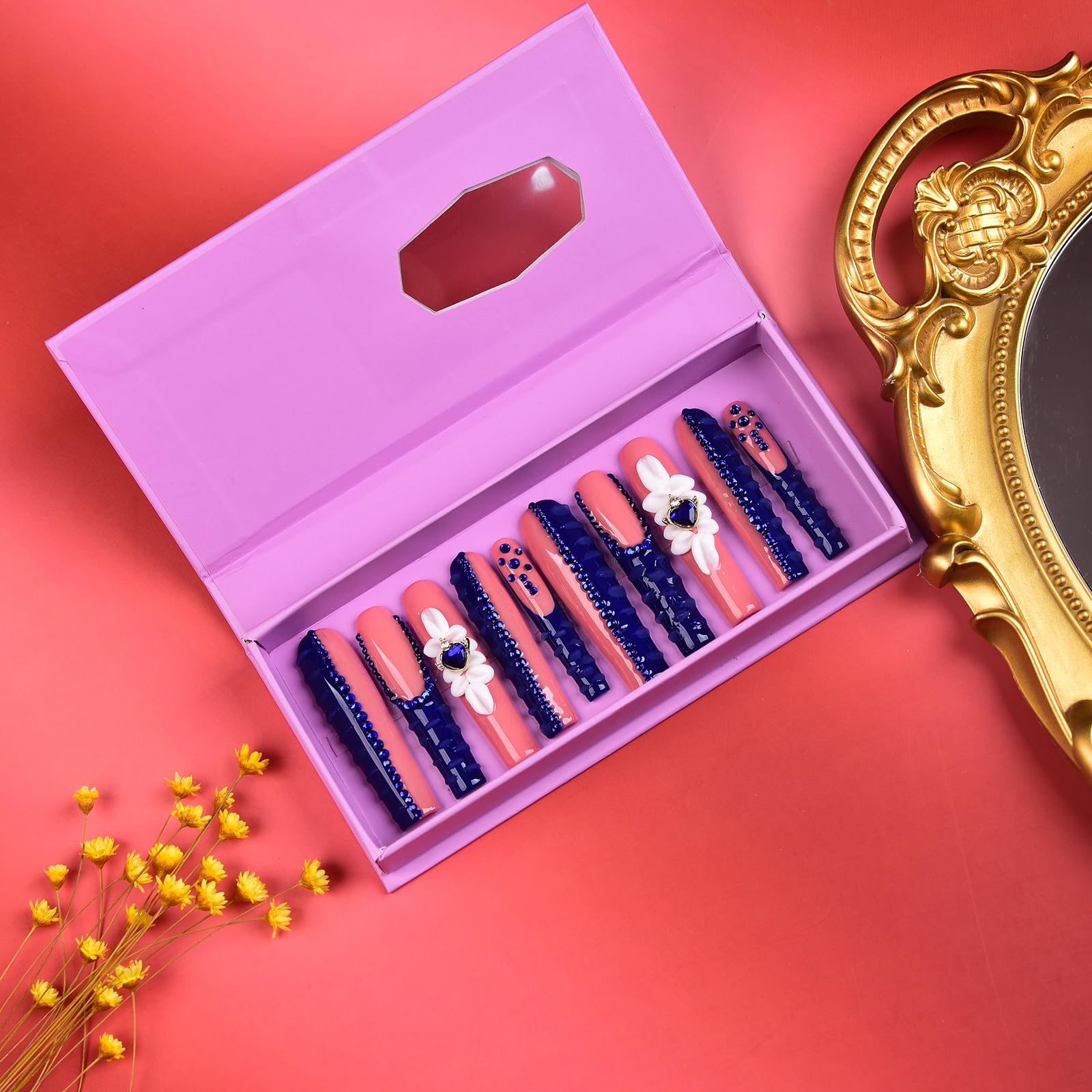 Tmani square tips with crystal glitter deliver a bold party-ready look.