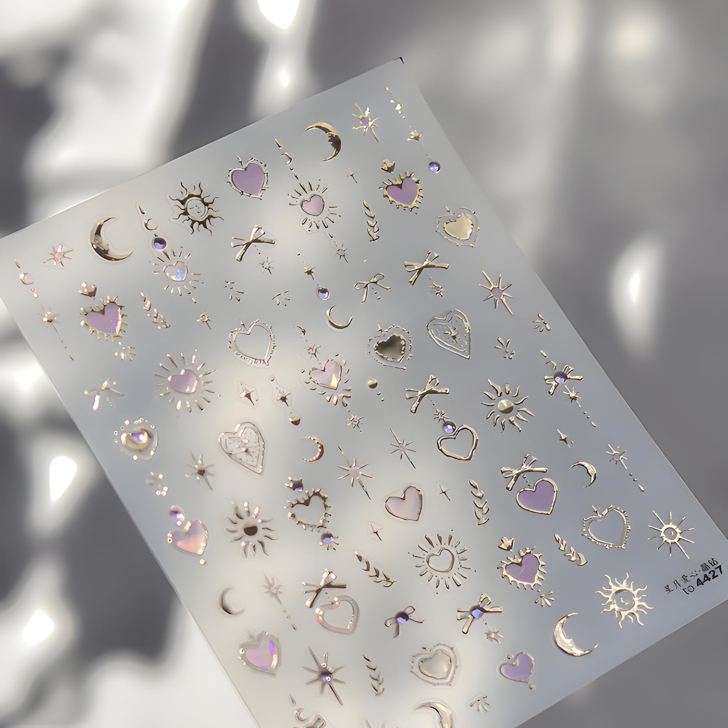 Tnbuokas bow design gold decals add elegant accents to gel or acrylic nails.