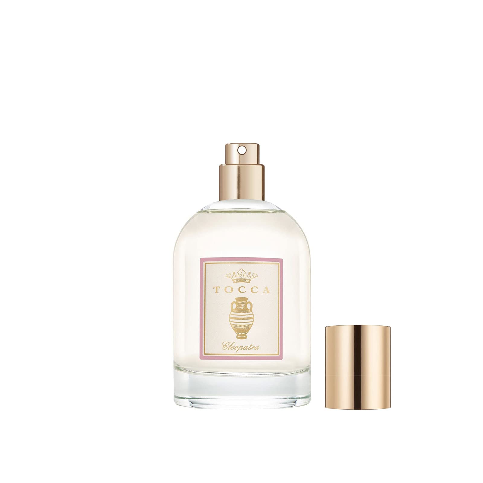 TOCCA Cleopatra dry oil bottle lit by sunlight suggesting lasting fragrance