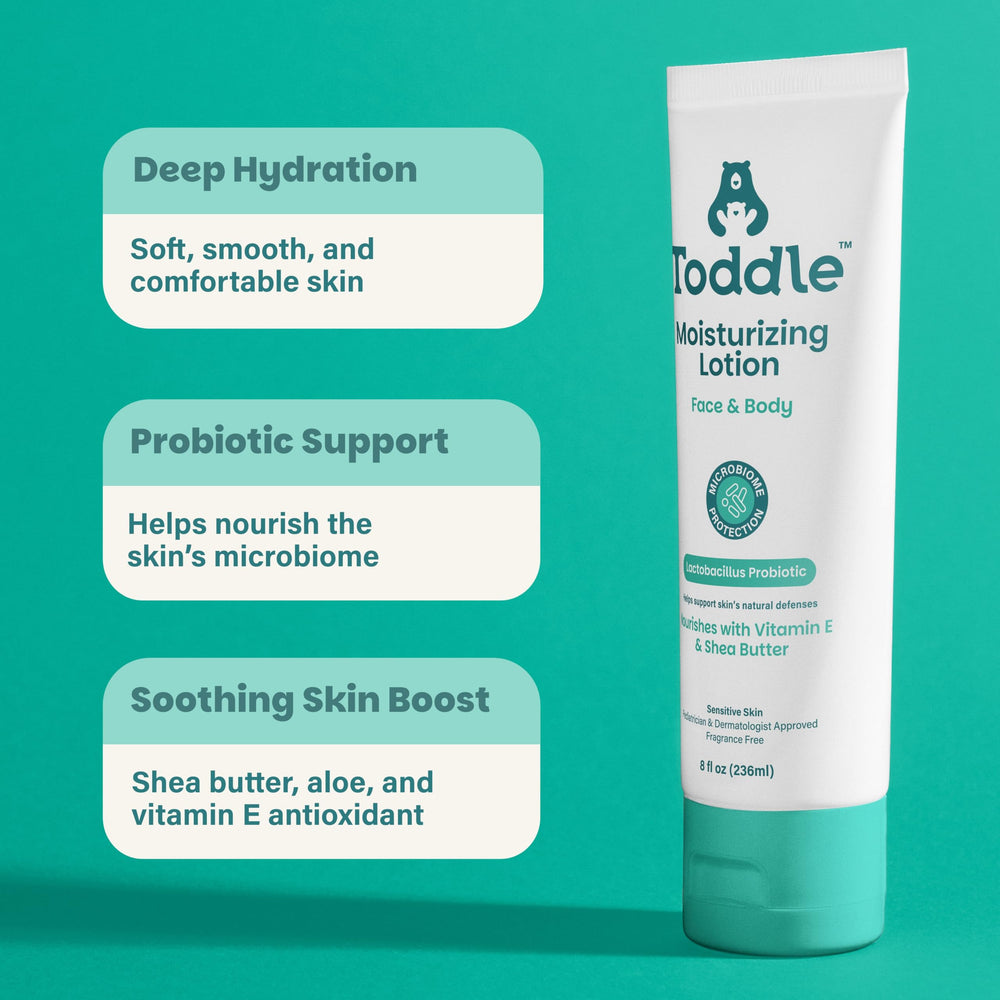 Toddle lotion being gently applied to a baby’s arm for daily moisturization