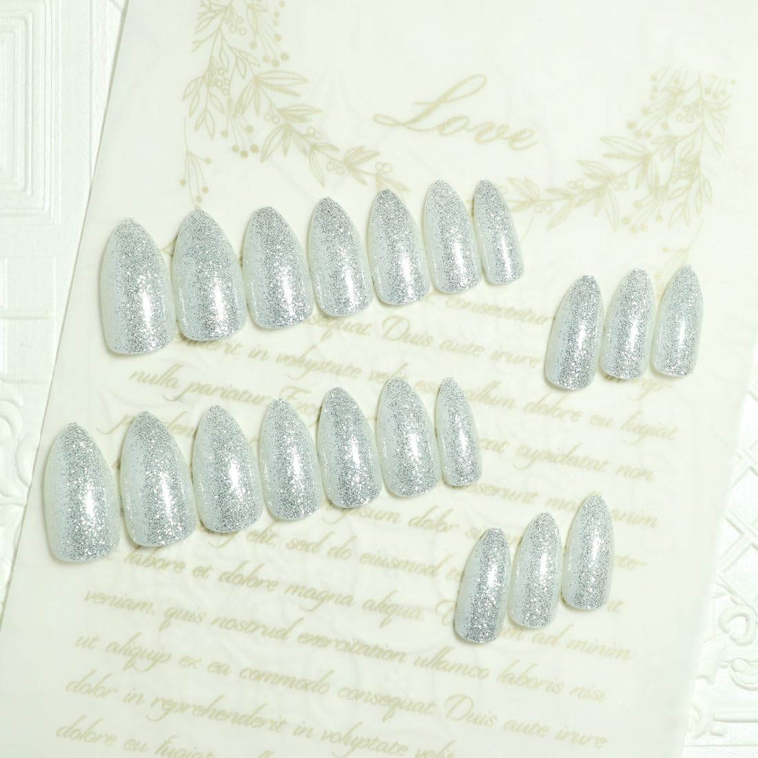 TOGZOM glitter nails application step showing peel-and-press method.