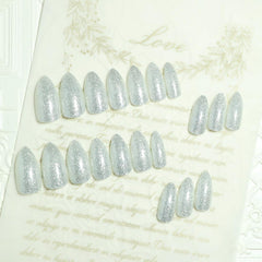 TOGZOM glitter nails application step showing peel-and-press method.