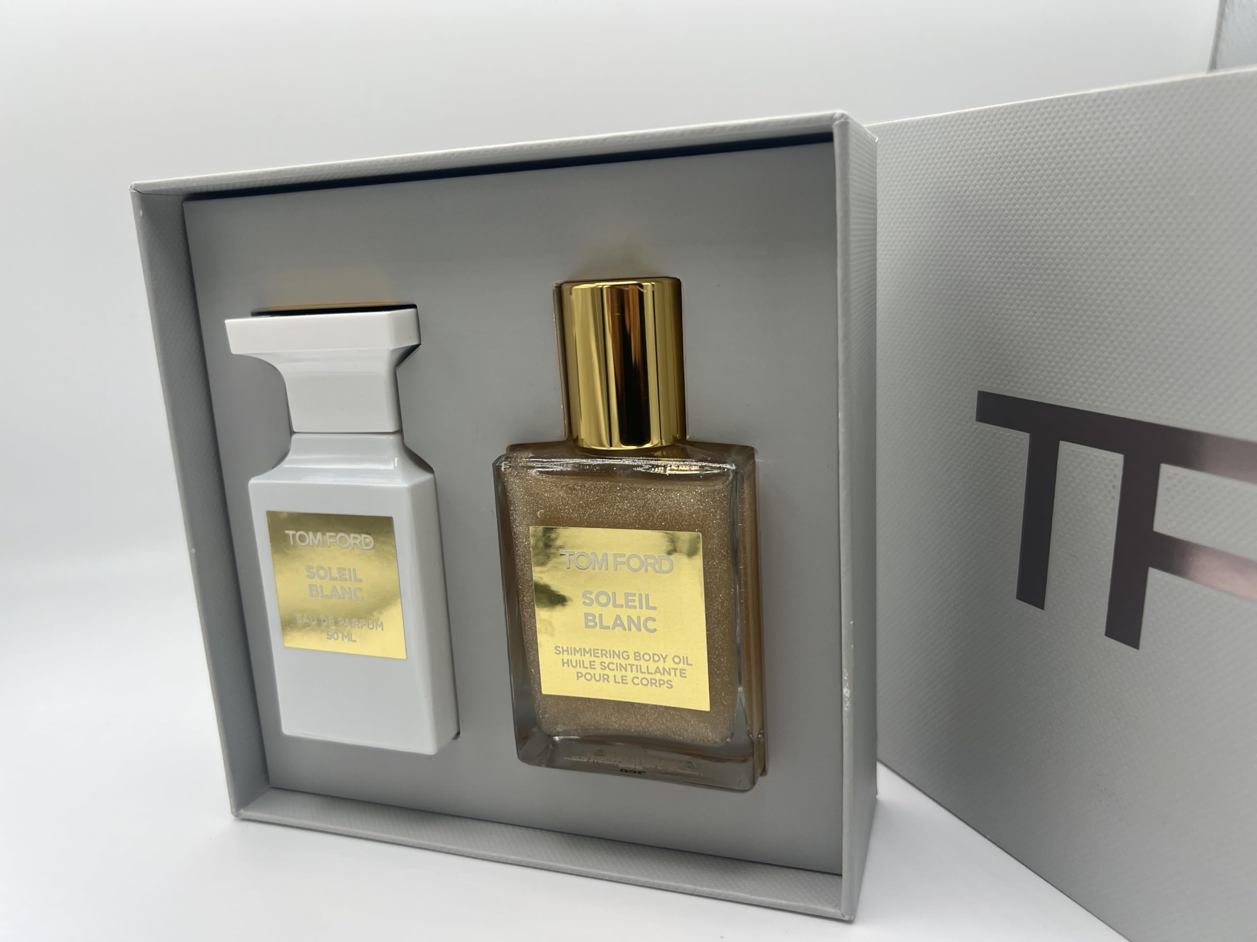 Tom Ford Soleil Blanc shimmering body oil bottle for radiant skin.