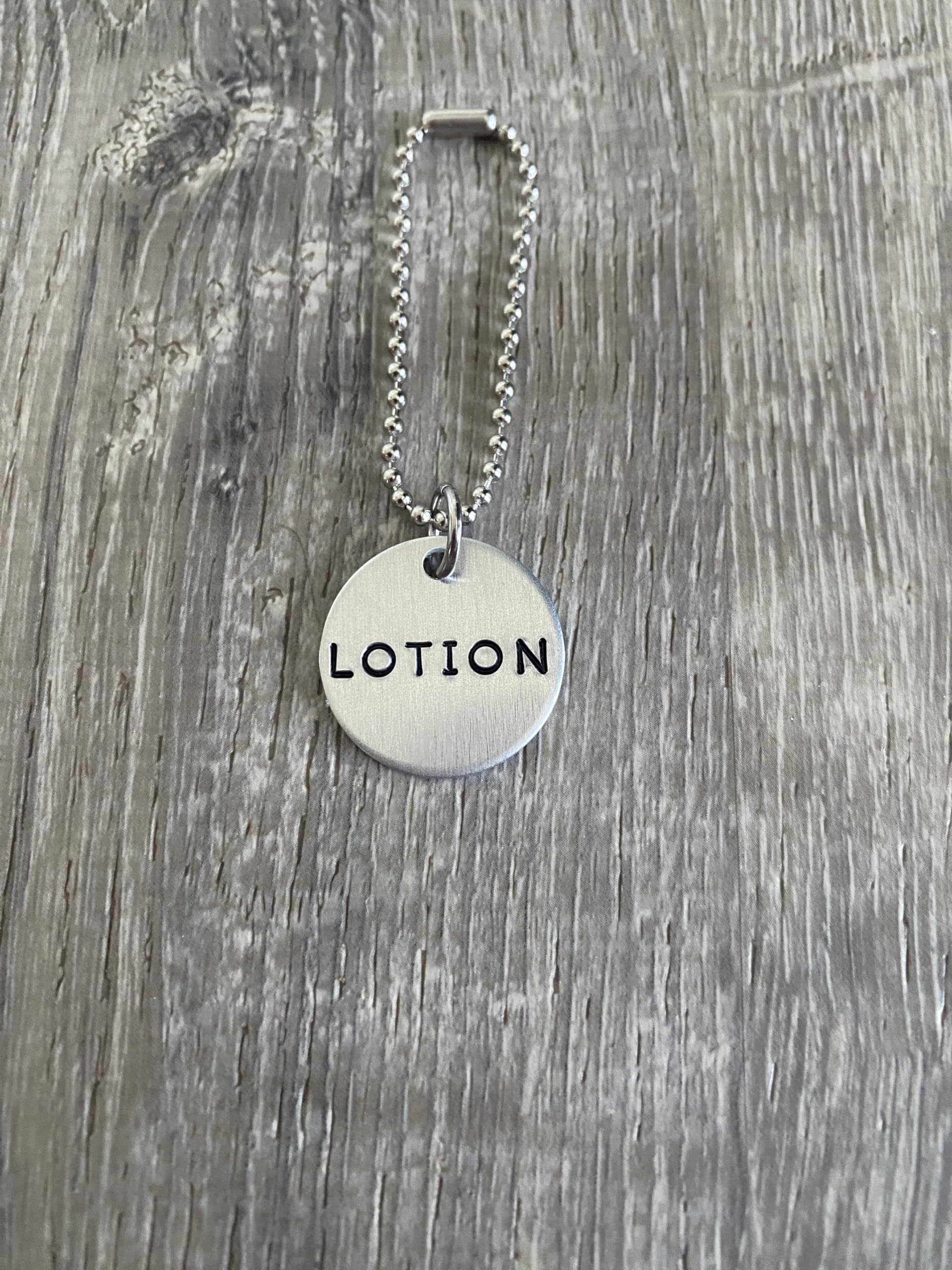 Top Shelf Tags hand-stamped tag aluminum silver finish offers a modern look.