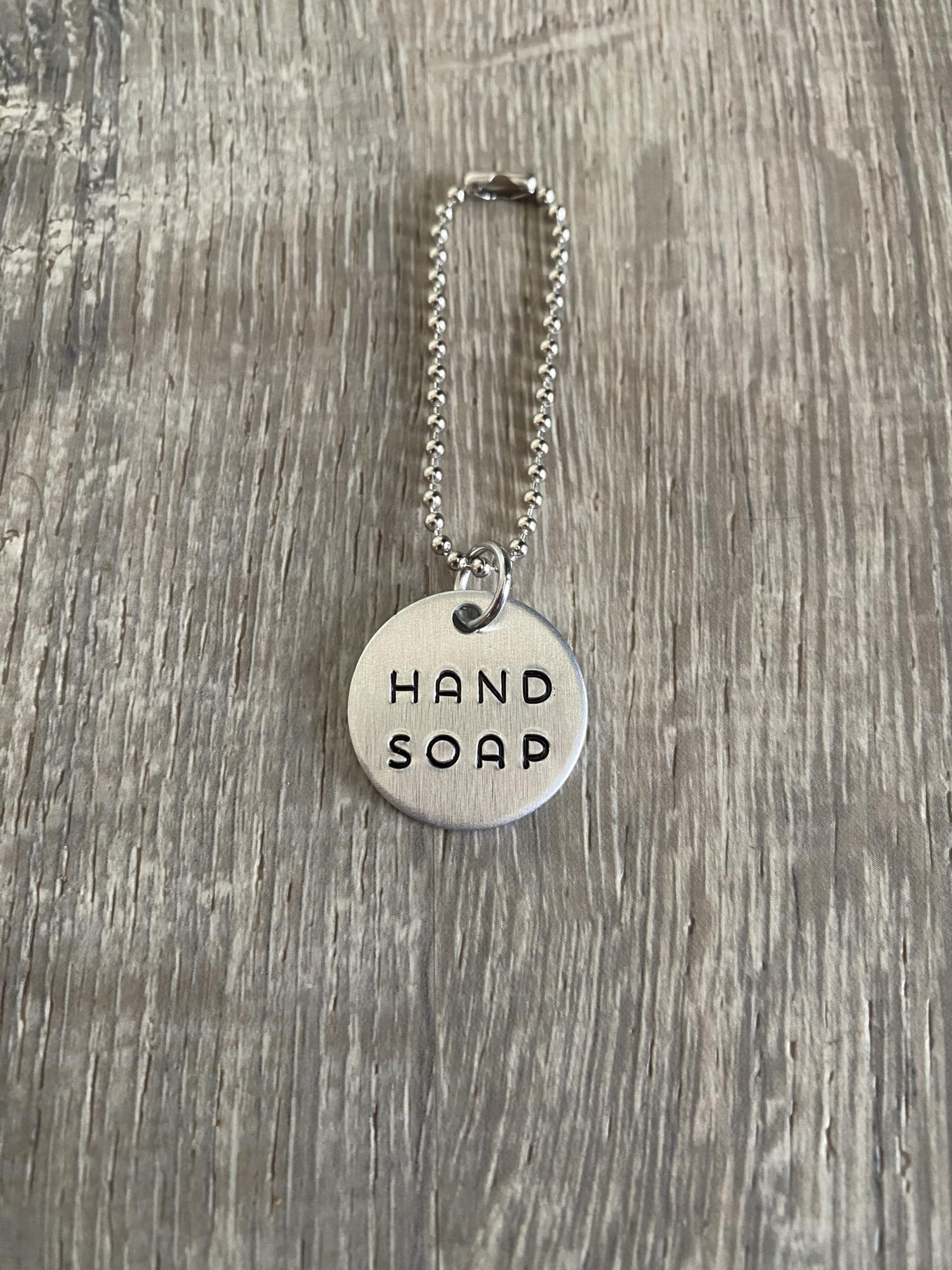 Top Shelf Tags hand-stamped tag brass finish adds a warm, artisan accent.