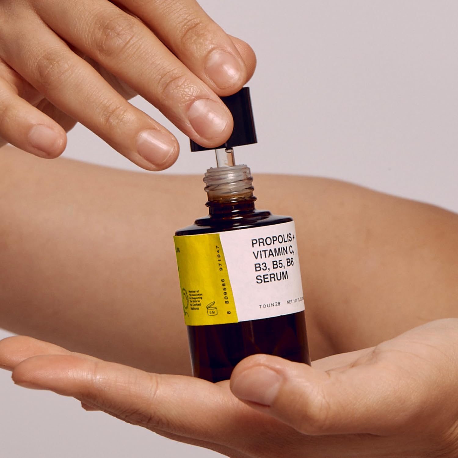 TOUN28 Propolis Vitamin C serum being applied to face for nourishment and smoothness