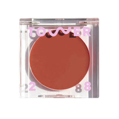 Tower 28 BeachPlease cream blush tint on lips and cheeks for a radiant glow.