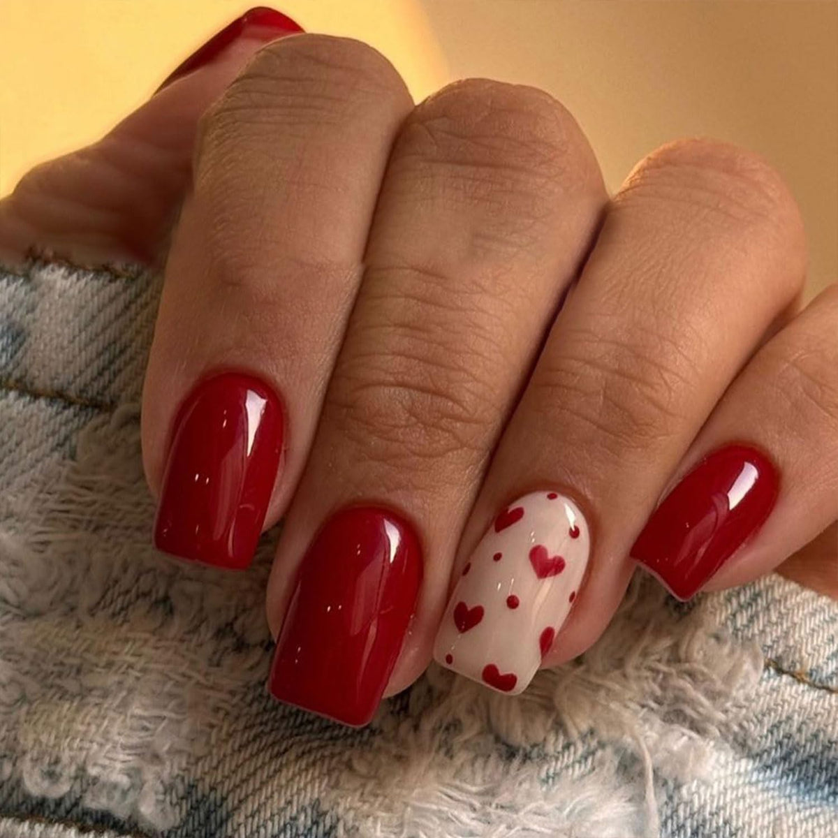 Toypoels Valentines nails with red heart designs for a festive look.