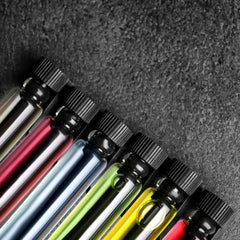 Tradeberry men’s cologne sampler 12-pack vials closeup to explore scent variety before purchase.