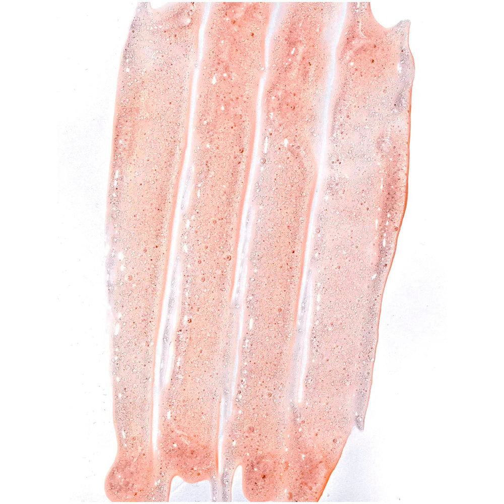 Hands massaging Tree Hut Pineapple Papaya Scrub into skin for smoother feel.
