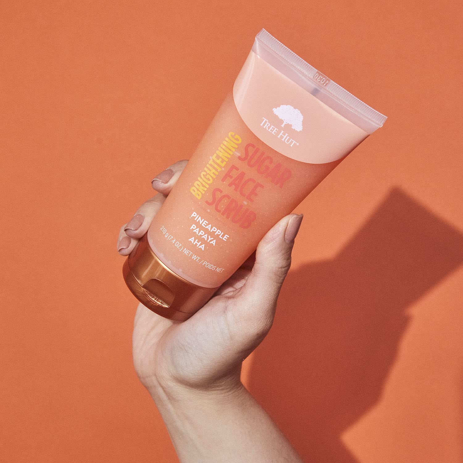 Ingredients list of Tree Hut Pineapple Papaya Scrub focusing on natural exfoliants.