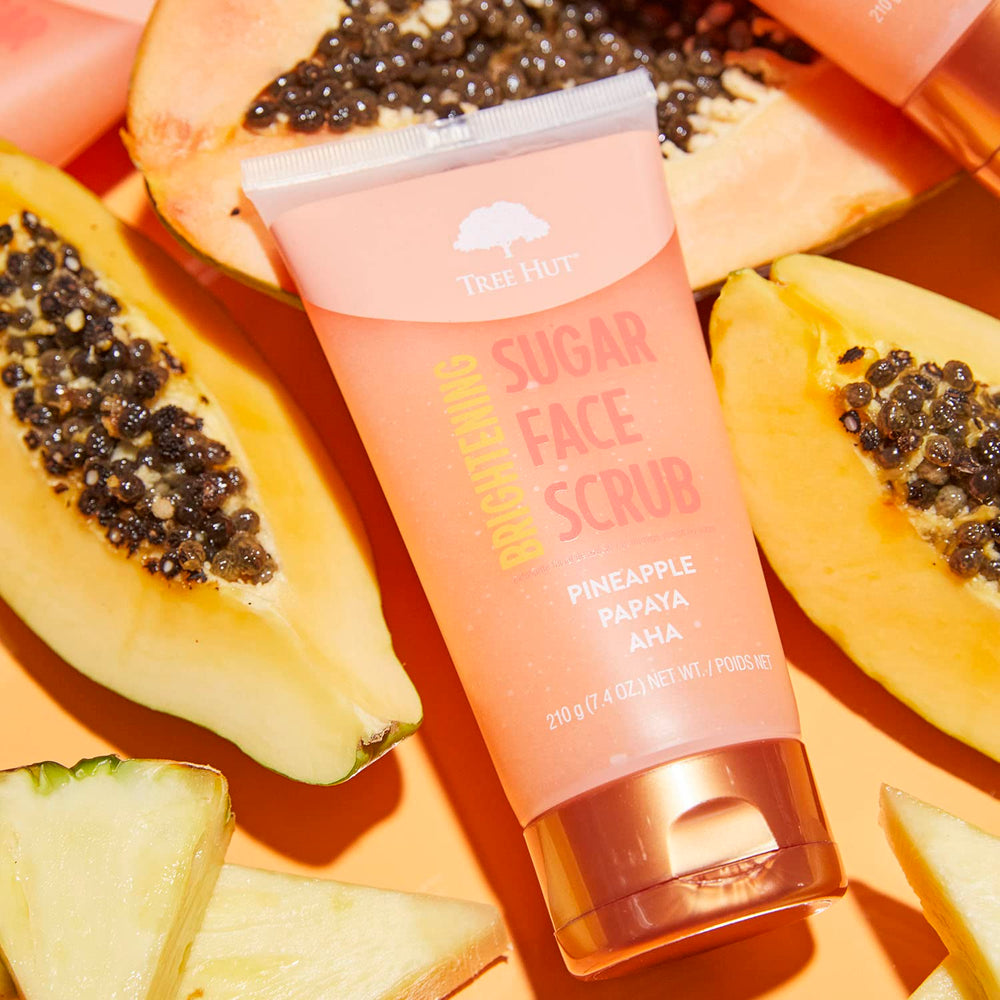 Tree Hut Pineapple Papaya Scrub tub displayed on bathroom shelf.