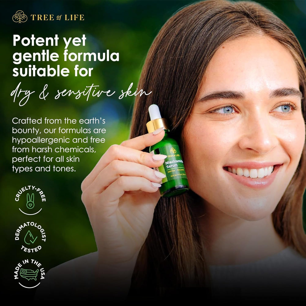 Application scene with fingertips applying Tree of Life Niacinamide Serum on sensitive skin.