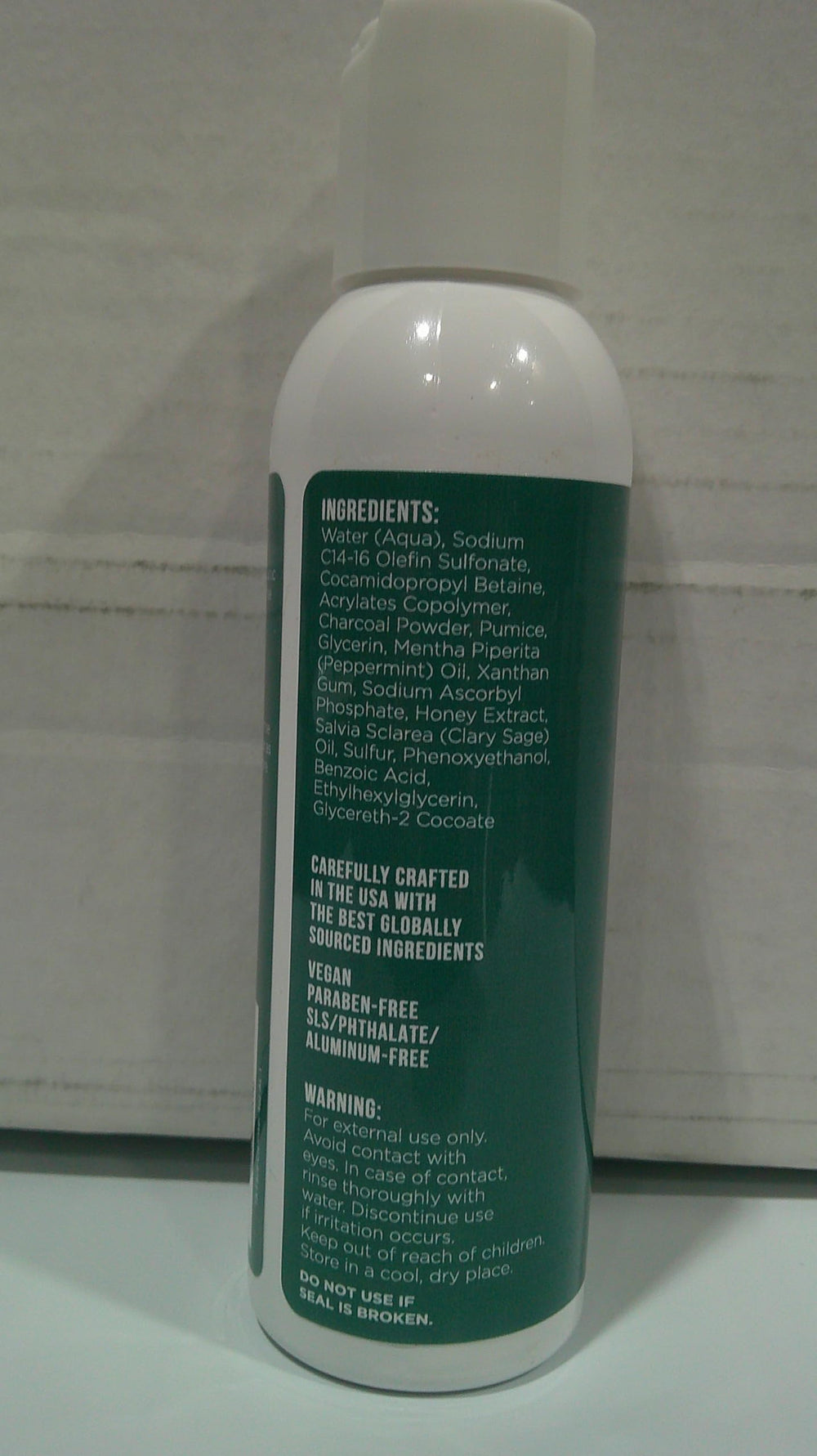 TreeActiv Charcoal Face Wash texture close-up showing charcoal particles
